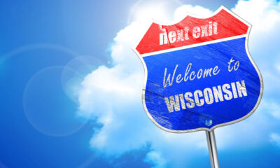 3D rendering, blue street sign saying next stop, welcome to Wisconsin